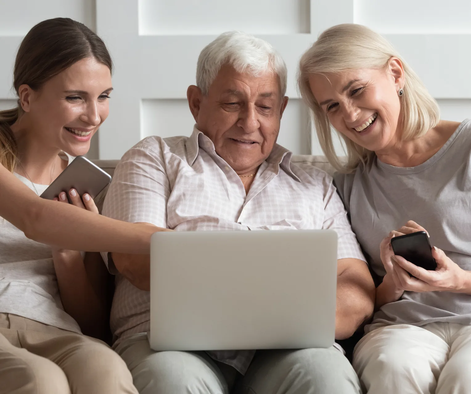 Older adults using a laptop together