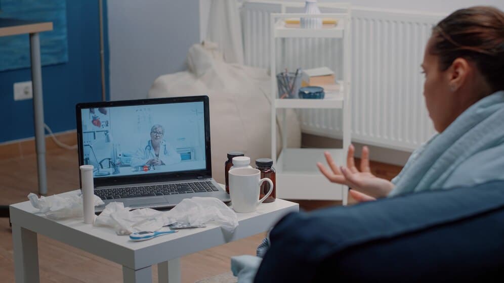 A patient talking with her psychiatrist during a telehealth medication management visit