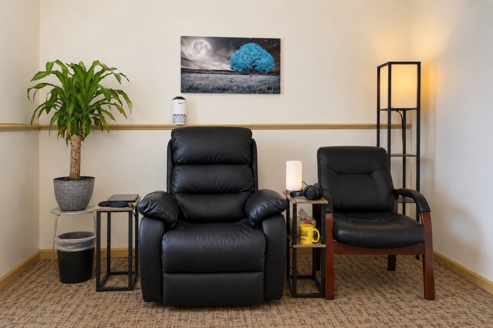 A Best Fit medication room with recliners, a side table, and comfort amenities